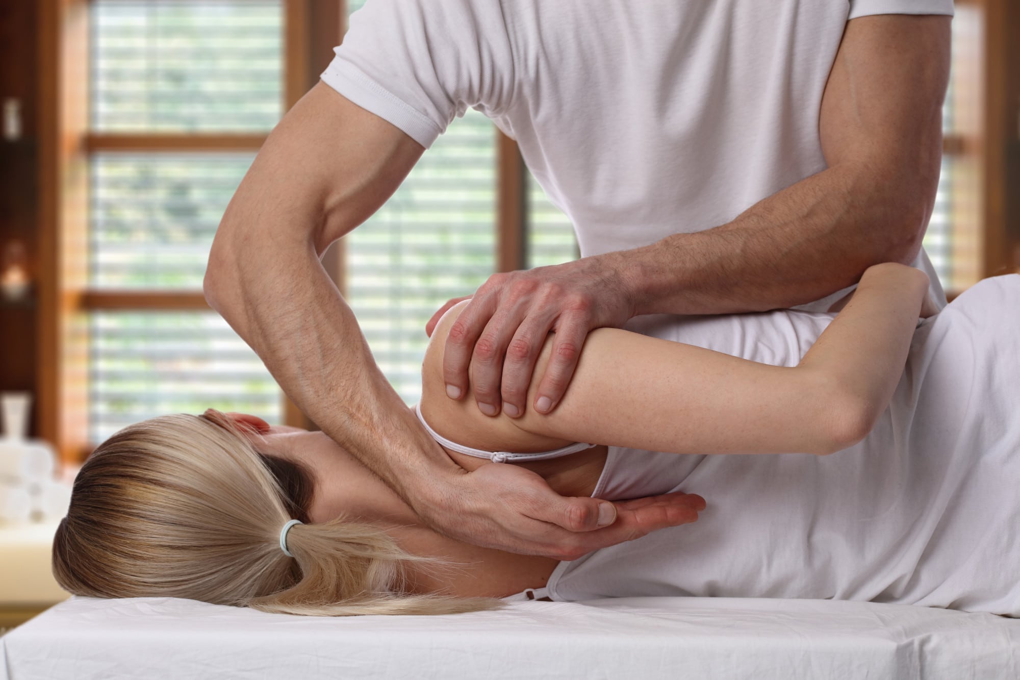 woman receiving chiropractic care adjustment from a chiropractor