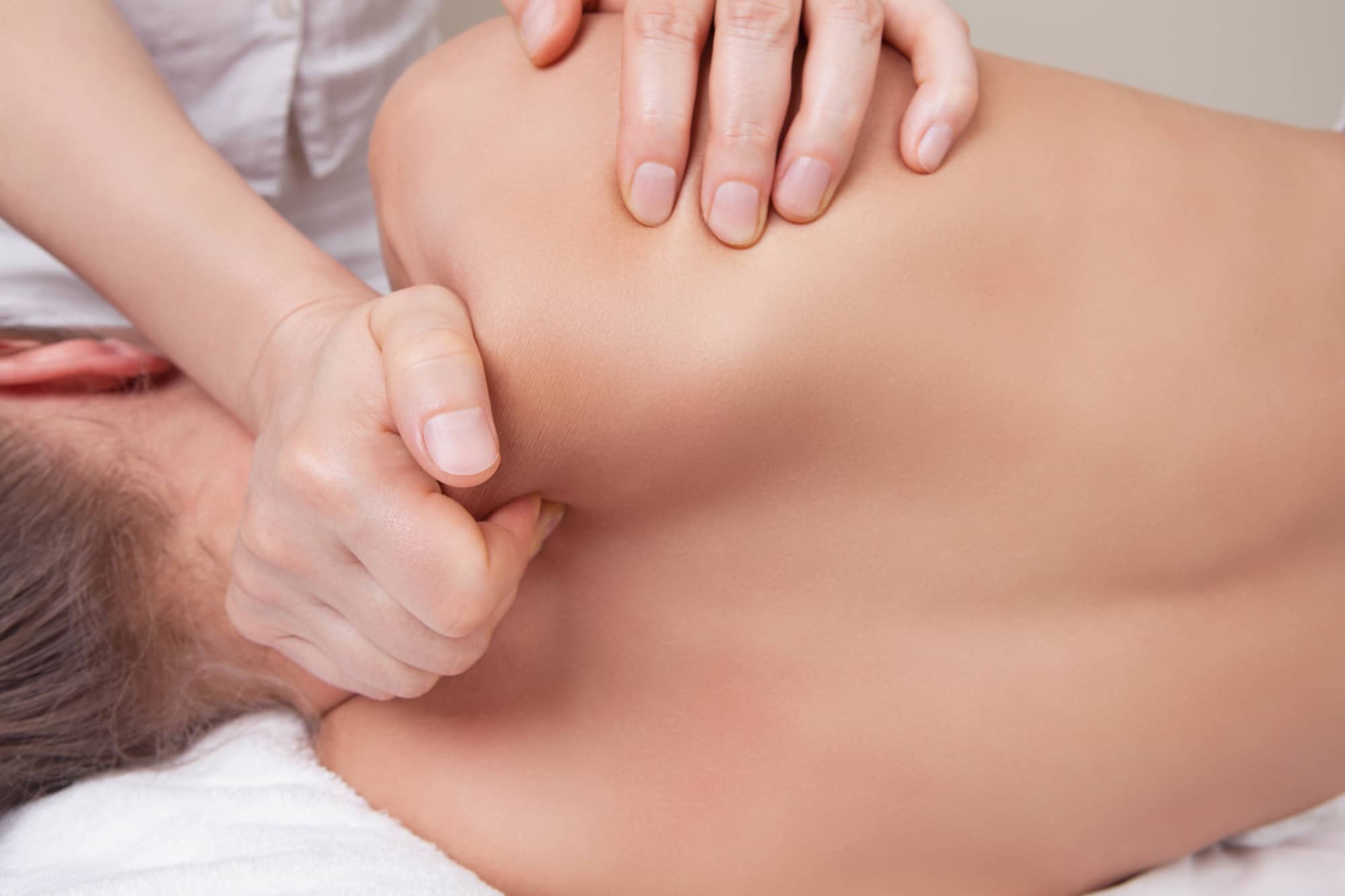 massage therapist working on a patient