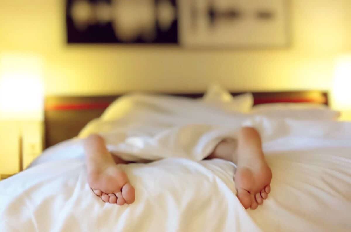 closeup of the feet of woman sleeping on her stomach