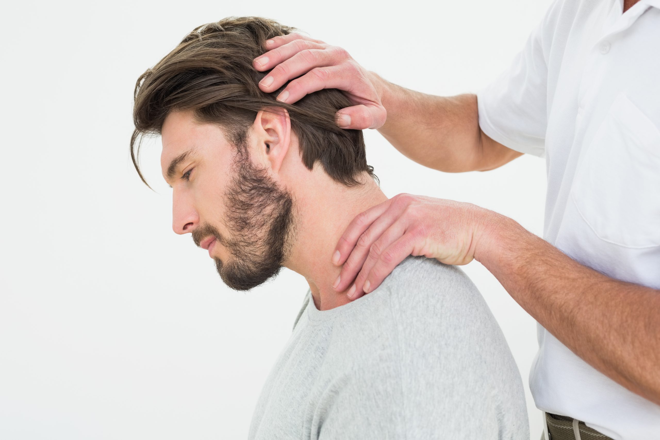 man getting neck adjustment from chiropractor